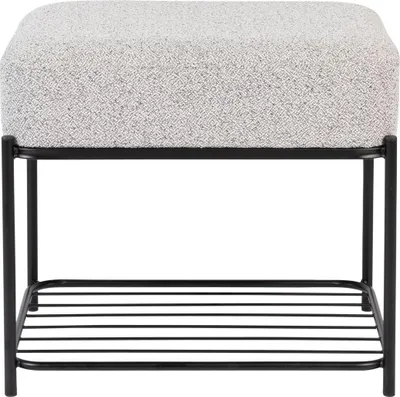 A product shot of a pouf with a metal frame and a fabric seat.