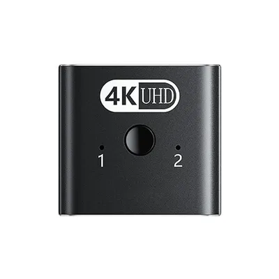 A black HDMI switch with '4K UHD' logo and two input indicators labeled '1' and '2'.