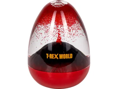 An egg-shaped lava lamp with red glitter suspended in clear liquid above a black volcanic-like base.