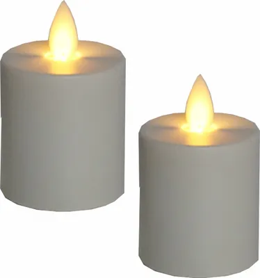 Two white LED candles with yellow flames are shown against a white background.