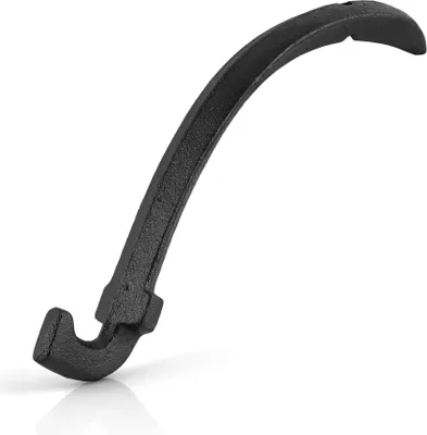 A black cast iron grill grate lifter is shown against a white background.