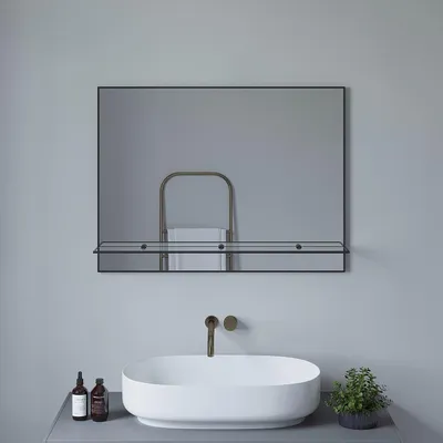 A bathroom vanity with a sink, faucet, and mirror.