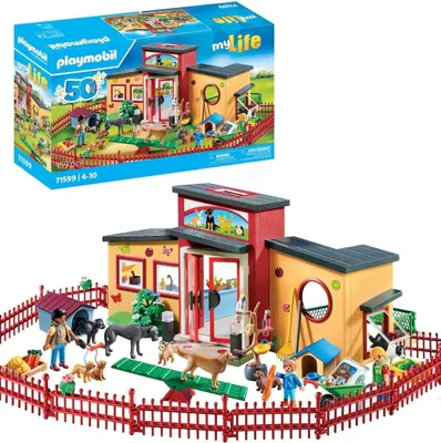 A Playmobil animal hotel playset with figures and accessories, shown with its packaging box above.