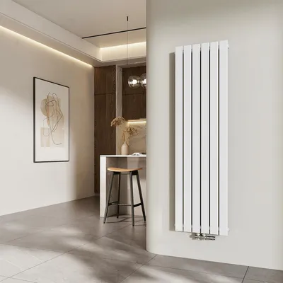 A modern interior with a vertical radiator, artwork, and a kitchen counter with a stool.