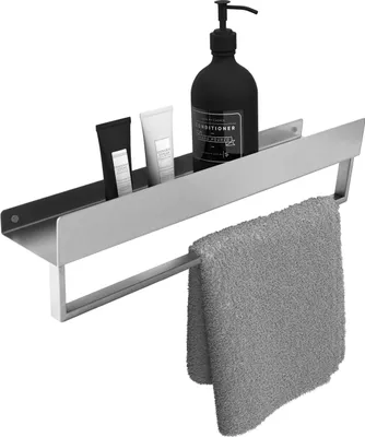 A bathroom shelf with toiletries and a towel.
