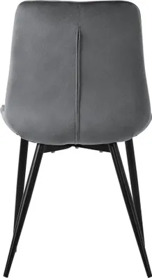 The back view of a gray velvet dining chair with black metal legs.
