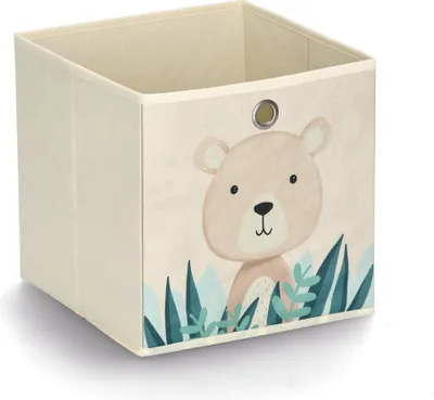 A beige storage cube with a cartoon bear and foliage design.