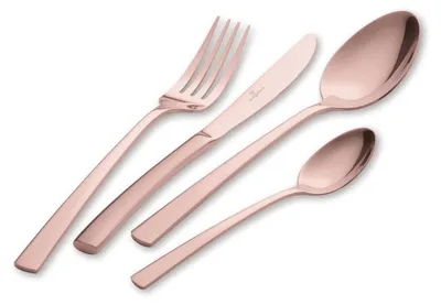 A set of rose gold cutlery, including a fork, knife, and two spoons, is arranged diagonally on a white background.