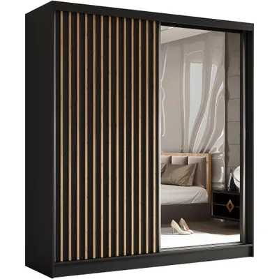 A sliding door wardrobe with a black frame and wooden slats on one door, and a mirrored door reflecting a bedroom interior.
