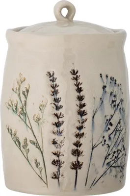 A ceramic jar with a lid, decorated with pressed flowers.