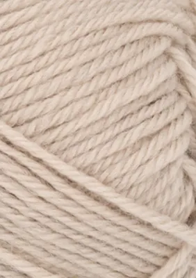 A close-up, textured view of a ball of beige yarn.