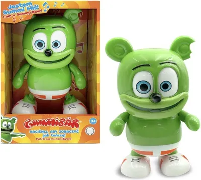 A green Gummy Bear toy is shown in its packaging next to a separate image of the toy. The packaging has text and graphics related to the product.