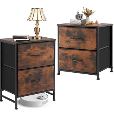 Two nightstands with fabric drawers are shown against a white background. A lamp and books are on the left nightstand, and decorative items are on the right. A robot vacuum cleaner is under the left nightstand.