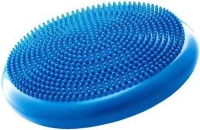 A blue balance cushion with raised nubs on a white background.