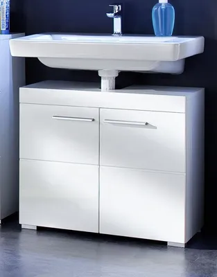 A white bathroom vanity with a sink and faucet.