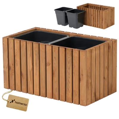 A wooden planter box with two black inserts and two separate black pots shown in the background.