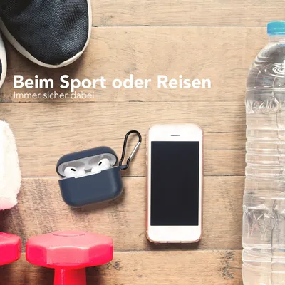 A flat lay of items for sports and travel, including shoes, dumbbells, a water bottle, a smartphone, and an AirPods Pro case.