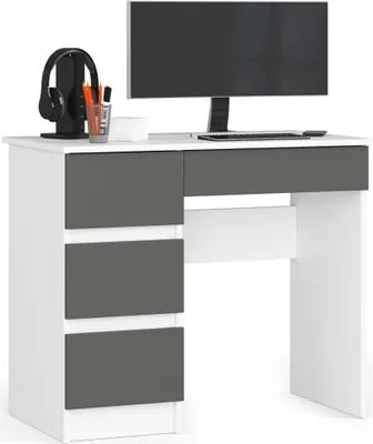 A white and graphite gray desk with a computer monitor, keyboard, and headphones.