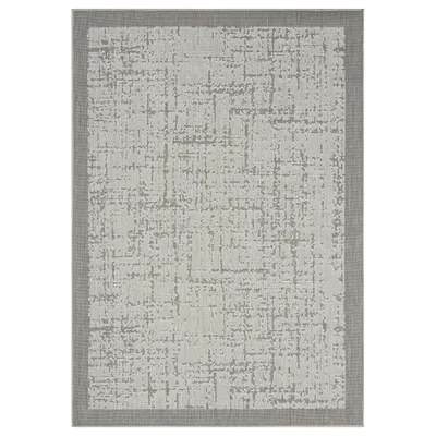 A flat lay image of a rug with an abstract pattern.