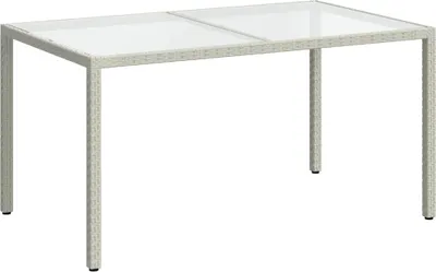 A white rattan outdoor dining table with a glass top, shown from a front-side angle against a white background.