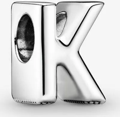 A close-up studio shot of a silver letter 'K' charm.