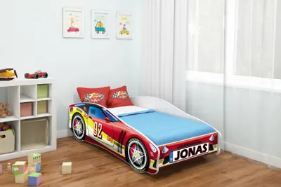 A child's bedroom with a car-shaped bed.