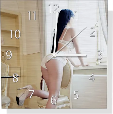 Produktbild von Wallario Design Wanduhr Sexy Dessous - Junge Frau mit eleganten Beinen am Fenster aus Aluverbund, Größe 30 x 30 cm