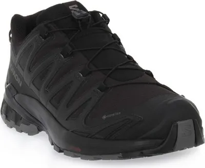 A black Salomon trail running shoe is shown from a side-angle on a white background.