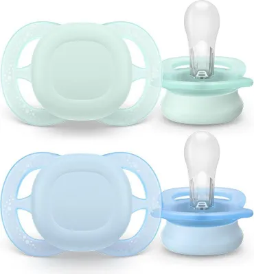 Two pairs of baby pacifiers, one green and one blue, displayed against a white background.