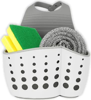 A kitchen sink organizer with sponges and a scrub brush.