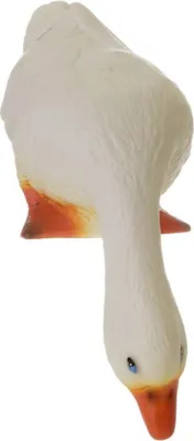 A white goose figurine with orange feet and beak, and blue eyes, is shown from a top-down perspective.