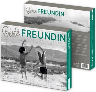 Two advent calendars, one in front of the other, with a black and white image of two girls jumping on a beach.