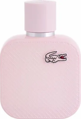 A pink Lacoste L.12.12 Rose Eau de Parfum bottle with the iconic crocodile logo.