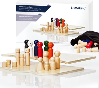A family constellation system board with wooden figures and a storage bag.