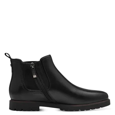 A studio shot of a single black leather boot against a white background.