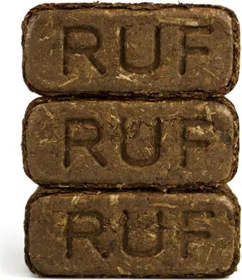 Three stacked brown briquettes with the letters 'RUF' embossed on them.