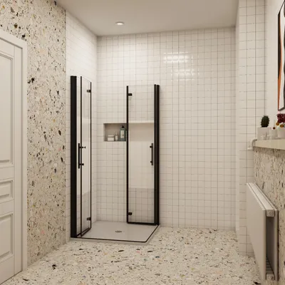 A modern bathroom with a corner shower enclosure, terrazzo flooring, and tiled walls.