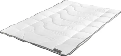 A white comforter with a gray trim is laid out on a white background.