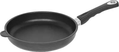 A black frying pan with a black handle is shown against a white background.