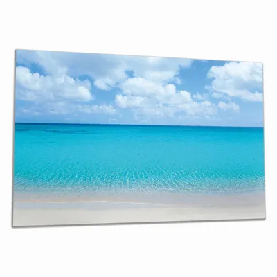 Produktbild von Wallario Herdabdeckplatte aus Glas, Größe 90 x 52 cm 1-teilig, Motiv Sandstrand und blaues Meer