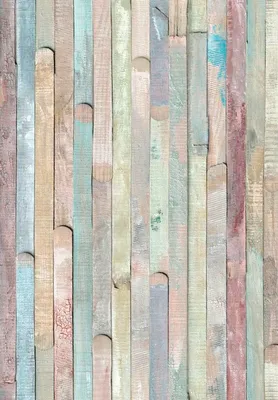 A wall covered in vertical wooden planks painted in various pastel colors.