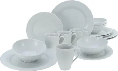 A collection of white porcelain dinnerware, including plates, bowls, and mugs, arranged on a white background.