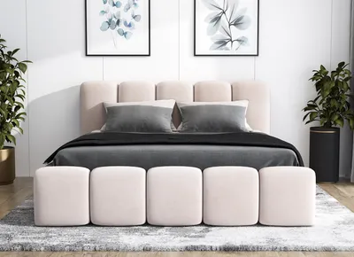 A bedroom scene with a bed, pillows, and decorative plants.