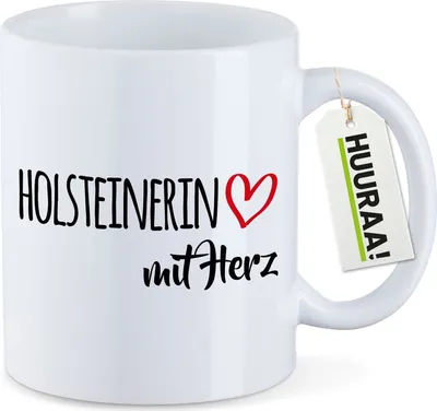 Produktbild von Huuraa Kaffeetasse Holsteinerin mit Herz 330ml Weiß Keramik Kaffeebecher Geschenkidee