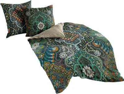 A bedding set with two pillows and a duvet cover, all featuring a colorful, intricate pattern.