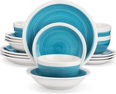 A stack of blue and white ceramic plates and bowls.
