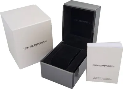 The image shows an opened watch box with its outer packaging and instruction manual.