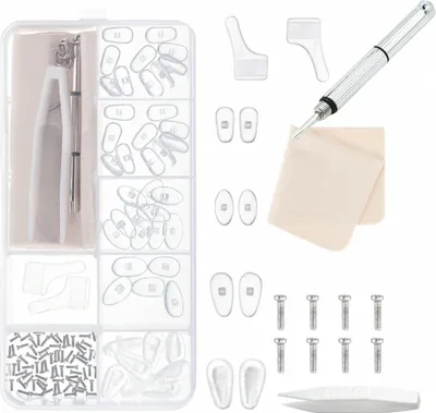 A kit for repairing glasses, laid out on a white background.