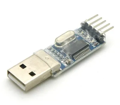 A single USB to TTL/UART adapter with a PL2303HX chipset is shown on a white background.