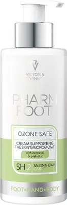 A product shot of a pump bottle of cream.